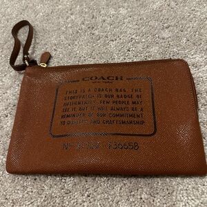 Coach Large Tan Wristlet with Text Design